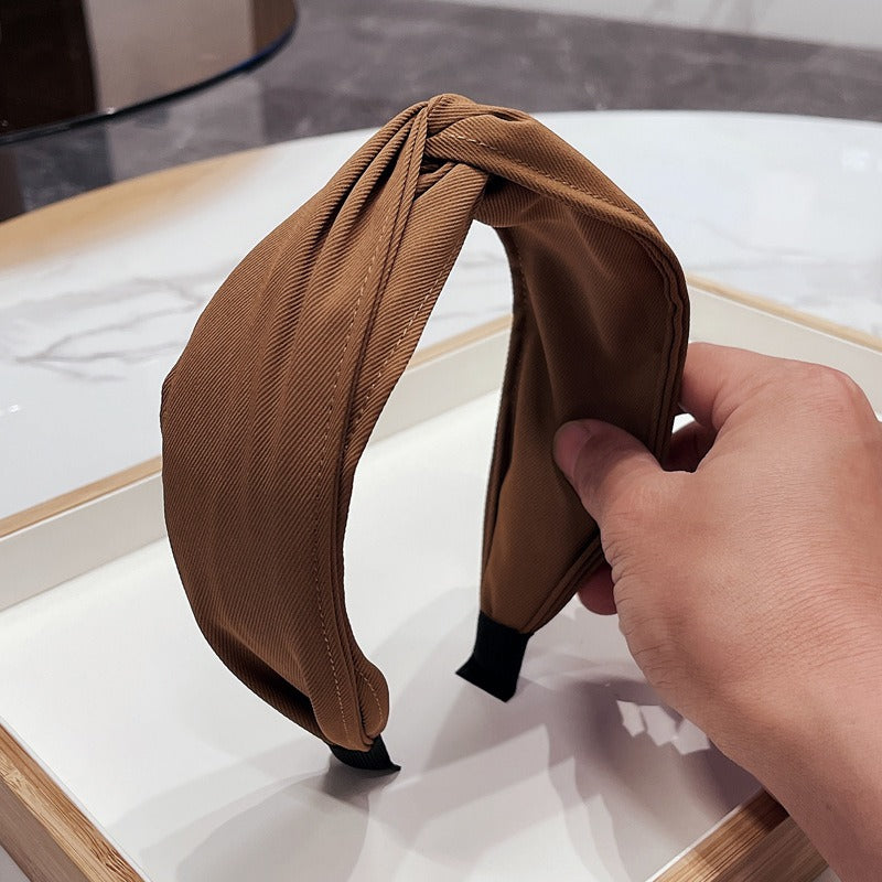 Fashionable fabric cross bow headband