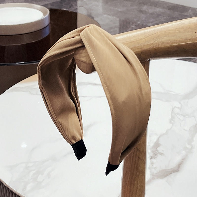 Fashionable fabric cross bow headband