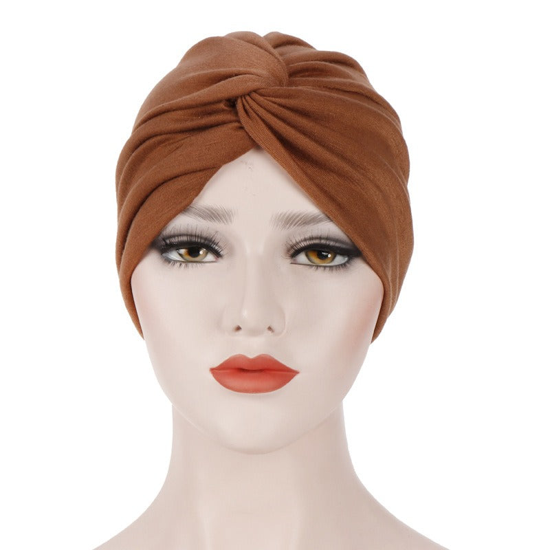 New elastic fabric with crossed candy colored twisted hat and candy colored base on the forehead