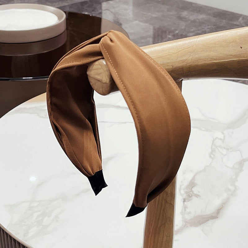 Fashionable fabric cross bow headband